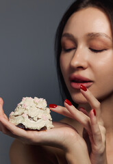 Beauty portrait of a pretty girl with a cake 