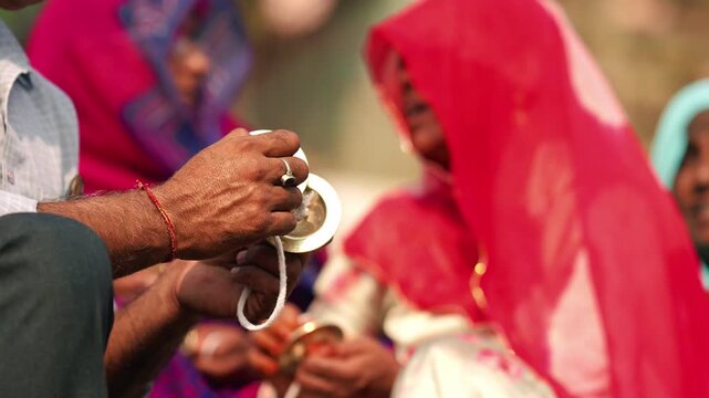 Devotees play jhaal (metal cymbals) during a Hindu pooja ceremony. The rhythmic sound of devotion fills the air with divine energy, peace, and spiritual harmony.
