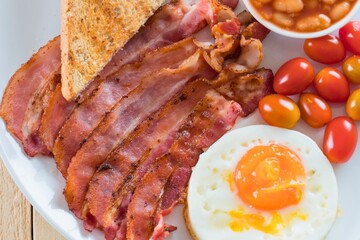 Classic full english breakfast with bacon eggs toast and beans