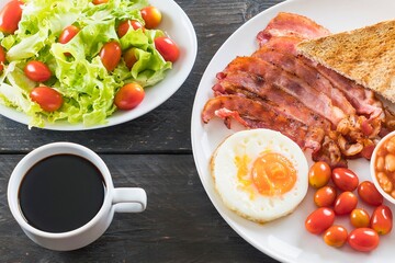 Hearty breakfast spread with coffee salad and bacon