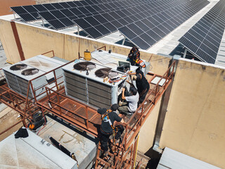Industrial air conditioning repair technicians at work