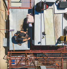 Industrial air conditioning repair technicians at work