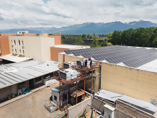 Industrial air conditioning repair technicians at work
