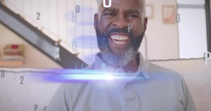 Senior man reacting to alphanumeric overlay, turning toward camera and laughing during tech demo