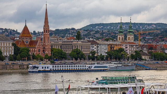 Budapest, Hungary - 7 July , 2025:  Budapest with the Balna (Whale) and the tourist ships moored on the bank of the Danube river