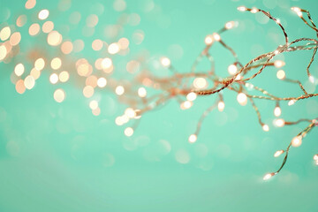 turquoise bokeh branch with twinkling lights, quiet outdoor vignette featuring delicate bare twig wrapped