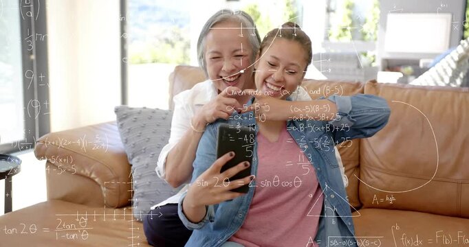 Teenager taking selfie with phone on sofa, adult fixing hair, math overlays rising on faces, edtech