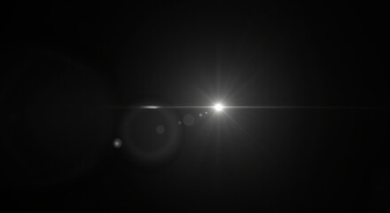 Realistic optical lens flare effect isolated on a black background. Bright white light source with a glowing starburst and rays. Abstract cinematic overlay for design