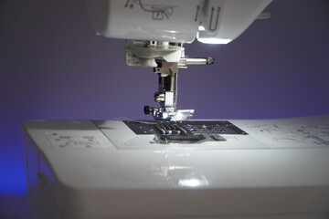 Stylish sewing machine glowing with neon colors
