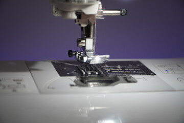 Stylish sewing machine glowing with neon colors