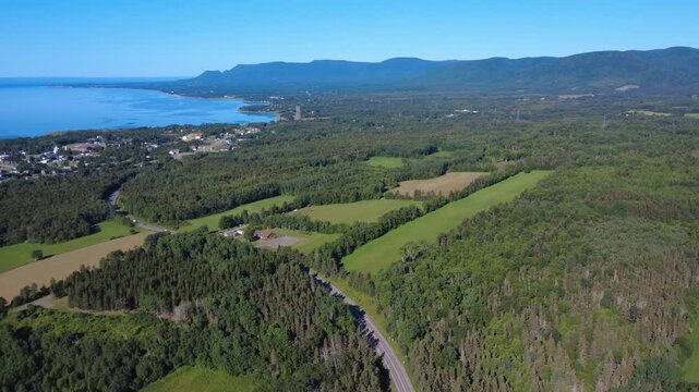Panoramic aerial view of the village of Maria and the Mi'kmaq Indian reserve of Gasgapegiag facing the Bay of Chaleurs at the mouth of the salmon river Cascapedia, Quebec, Canada, 2025.