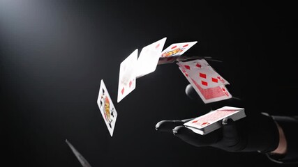 Professional magician's gloved hand skillfully throwing playing cards from one hand to the other against a dramatic dark background, representing magic, illusion, and entertainment concepts - Powered by Adobe