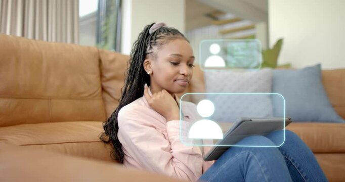 Woman tapping tablet on sofa making contact UI panels stacking while managing contacts for business
