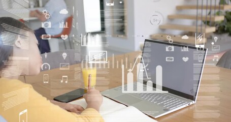 Teen girl studying, writing notes, tapping phone, laptop initiating data charts aligning keyboard - Powered by Adobe