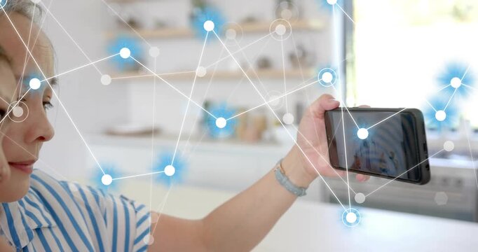 Mom holding phone teen leaning in phone initiating glowing node overlay expanding for tech sharing