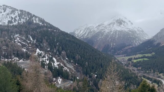 Panoramic view of Val Bregaglia, Switzerland in early spring with snow patches and crisp mountain air