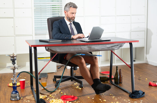 Comic Businessman in messy office. Funny business man during a video conference in messy office. Crazy business concept. Fun business team online. Humor in business. Messy funny office workspace.