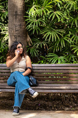 Woman talking on the phone in a park