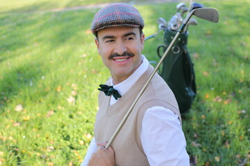 Handsome elegant golfer with a mustache 
