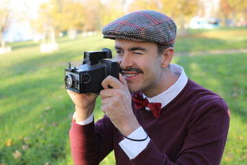 Vintage male photographer taking a shot 