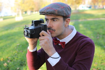 Vintage male photographer taking a shot 