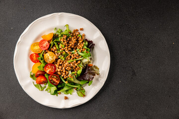 Lentil salad vegetables, tomato, green leaf lettuce tasty snack fresh delicious gourmet food table setting rustic top view copy space keto and paleo diet vegetarian and vegan food