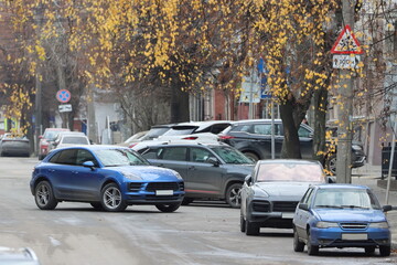A cluster of cars along the street