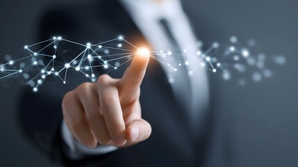 Close up of a fingertip connecting with a luminous node in a complex digital network of abstract lines and points signifying innovation and global data flow