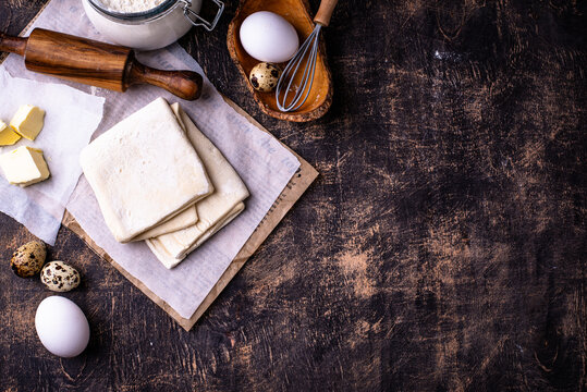Raw puff pastry dough with baking ingredient