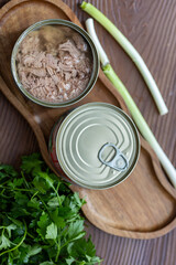 Close-Up of Vegetables with Tuna Can on Wooden Table
