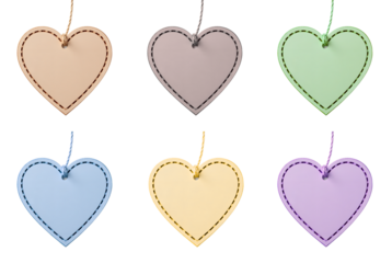 A collage of colorful pastel heart-shaped cutout tags. Blank paper labels with strings for gifts or messages isolated on a transparent background