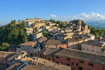 Colorful buildings and historic tower in the medieval town of Verucchio, Emilia-Romagna, Italy.