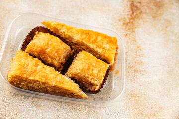 Baklava with pistachios and almonds dessert oriental sweets natural product tasty snack fresh delicious gourmet food background on the table rustic top view copy space