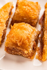 Baklava with pistachios and almonds dessert oriental sweets natural product tasty snack fresh delicious gourmet food background on the table rustic top view copy space