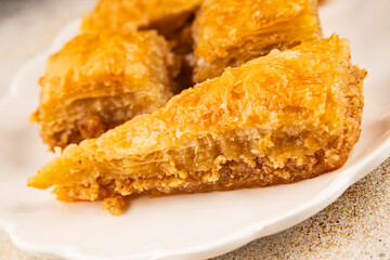 Baklava with pistachios and almonds dessert oriental sweets natural product tasty snack fresh delicious gourmet food background on the table rustic top view copy space
