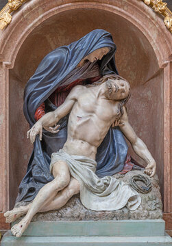 SALZBURG, AUSTIRA - SEPTEMBER 7, 2025: The carved polychrome Pieta in the church Erzabtei St. Peter by I. Piger from year 1886.