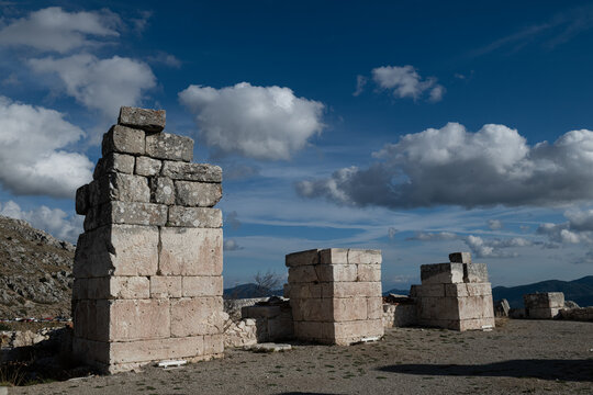 At Sagalassos, monumental pilon remains composed of stone blocks, rising toward the sky. Historical stonework.