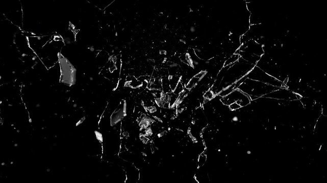 Super Slow Motion Shot of Breaking Real Glass at 1000 fps . Isolated on Black Background
