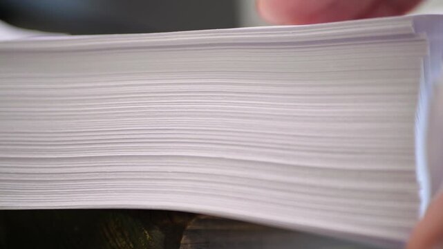 Thick Office Paper Stack Being Flipped at Corner with Rustling Sound, 500 Sheets Close Up Detail, Hand Motion Precision, Smooth Paper Handling, Office or Administrative Task Action, Page Texture Focus