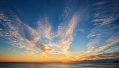 Fototapeta premium Sunset Sky Background Over The Coast Of Hudson Bay Blue Sky With Hints Of Yellow And Orange And White Wispy Clouds