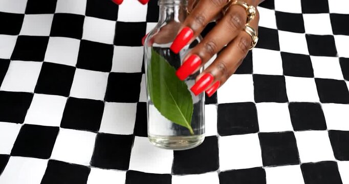Elegant Hand Recycling Glass Bottle. Sustainability, luxury, environment.