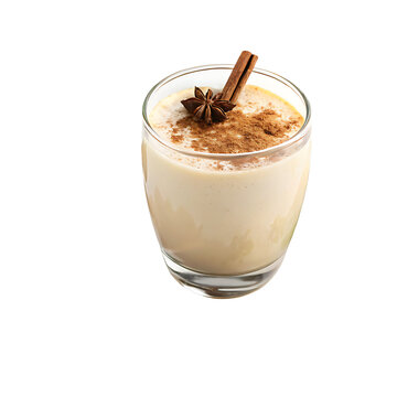 Creamy eggnog in a clear glass garnished with cinnamon stick, star anise, and ground cinnamon, perfect for holiday celebrations and winter beverages.