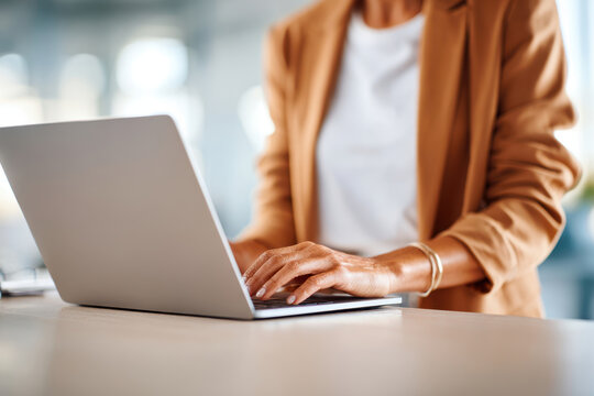 Woman working on laptop in modern office