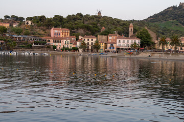 Evening view on sea bay, lights and colourful houses of Collioure, Cote Vermeille, Pyrenees-Orientales, Occitania, France. Summer vacation destination