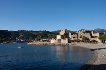 Fototapeta premium View on sea with beaches and colourful houses of Collioure, Cote Vermeille, Pyrenees-Orientales, Occitania, France. Summer vacation destination