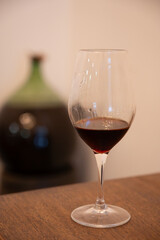 Tasting of Banyuls AOC aged natural sweet grand cru Banyuls fortified dessert wine from old vines from slopes Pyrenees in Roussillon, France made in glass jar Dame Jeanne or demijohn