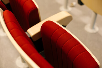 Rows of empty seats in the theatre auditorium.