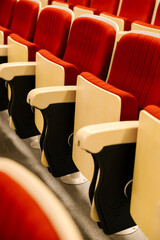 Empty red cinema seats in an auditorium