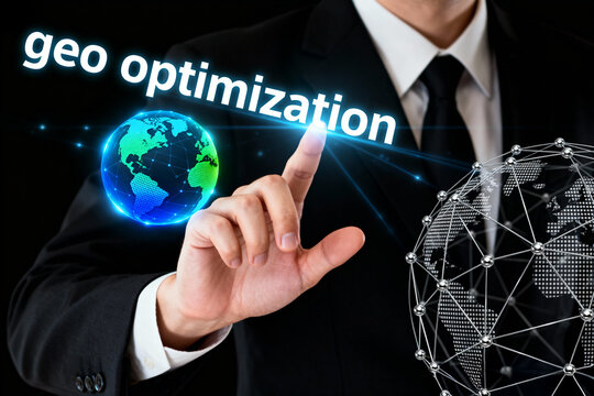 Man in suit pointing at glowing earth and wireframe globe with geo optimization text overlaying it - Powered by Adobe
