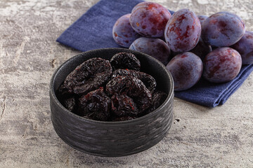 Black dry sweet prunes heap